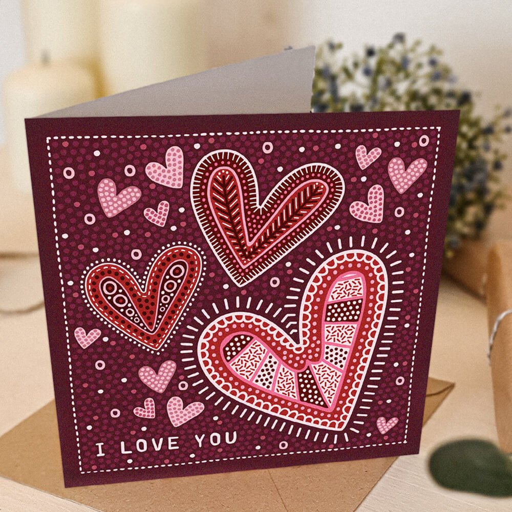 red romantic anniversary card with i love you message and illustrated hearts supplied with a recycled kraft brown envelope