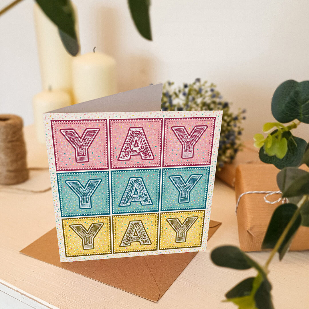 pink blue and yellow typographic congratulations card spelling yay yay yay supplied with recycled kraft brown envelope