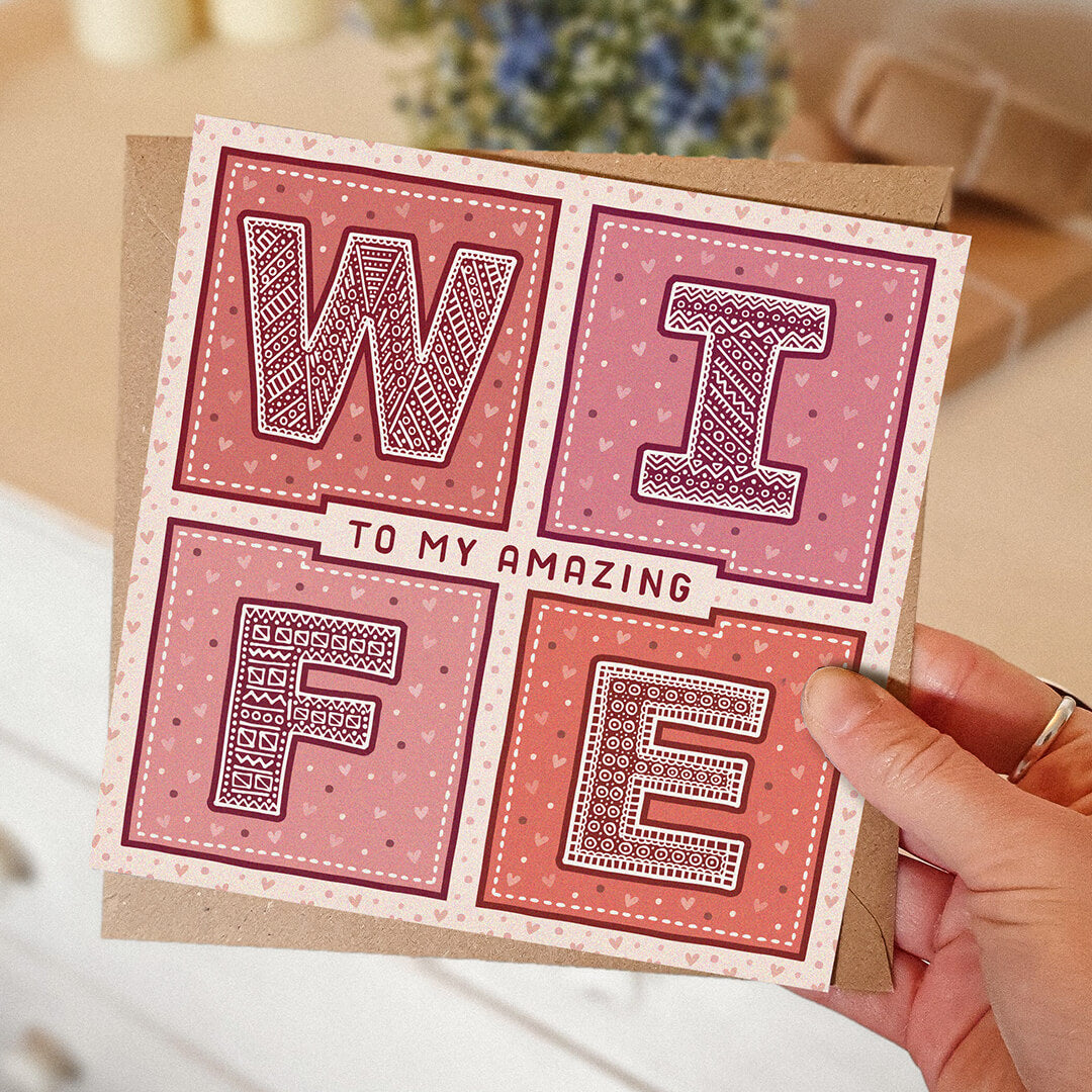 hand holding romantic valentines day card for wife Red and Pink to my amazing wife Valentines day card Printed on FSC-certified card with kraft brown recycled envelope Blank inside
