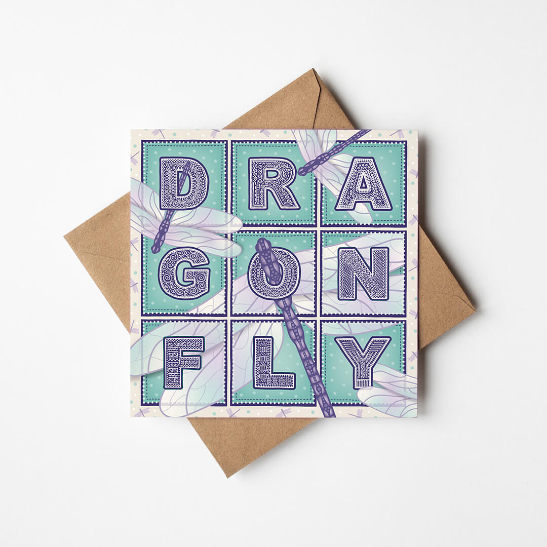 Purple and turquoise dragonfly greeting card with 'Dragonfly' text and dragonfly illustrations on a white background