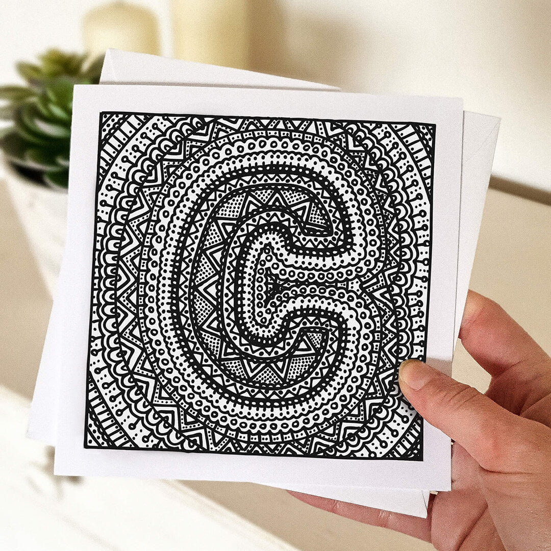 Hand holding letter C colouring in card Unique alphabet colouring in card Patterned typographic greeting card to colour in Blank inside