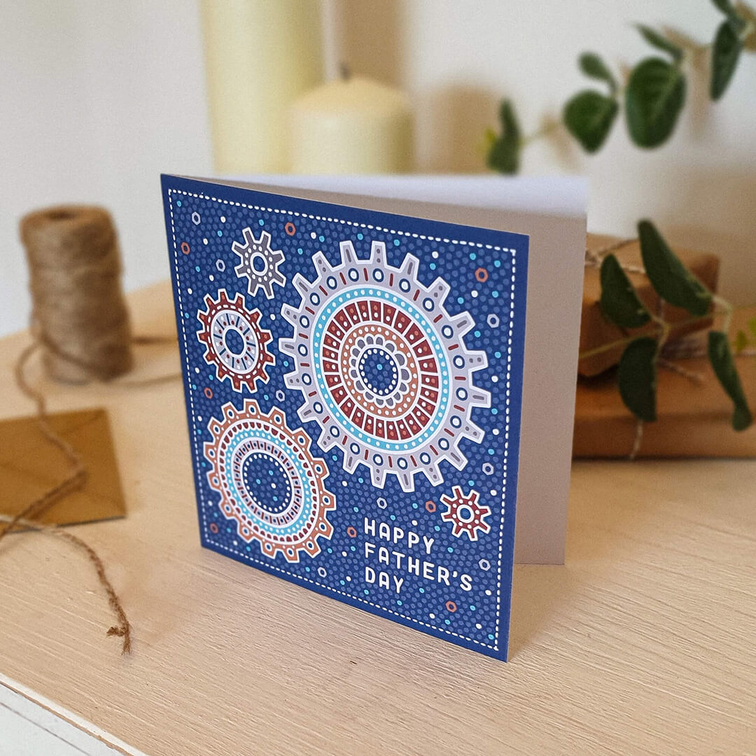 Blue mechanical Happy Father's Day card for mechanics and engineers featuring cog illustrations and supplied with a recycled kraft brown envelope