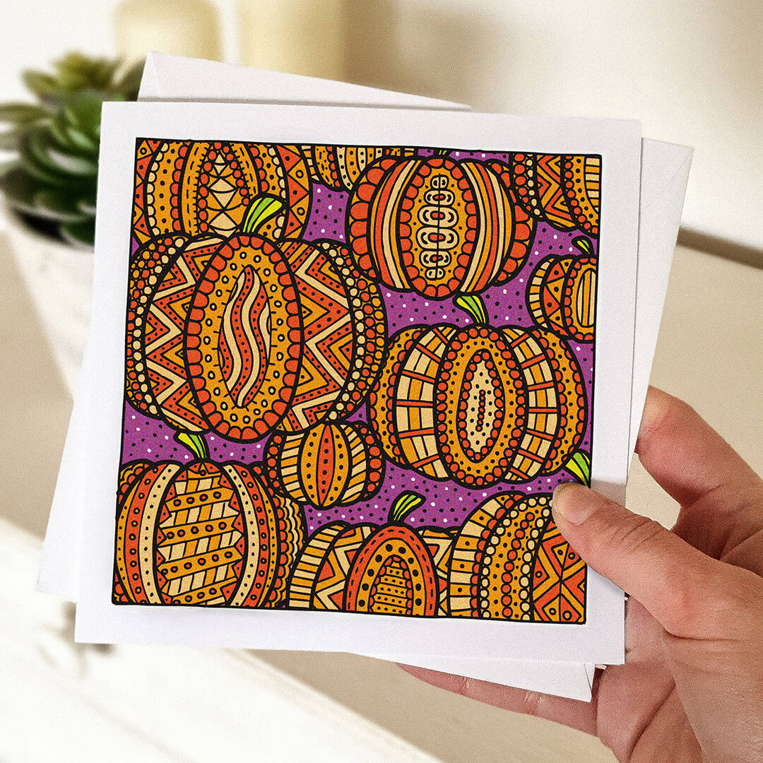 Hand holding orange pumpkin halloween card Unique patterned pumpkin illustration design Orange Purple Blank inside Supplied with envelope