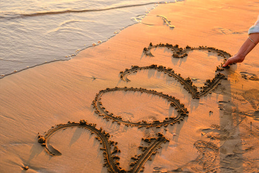 2023 written with a stick on a sunset sandy beach