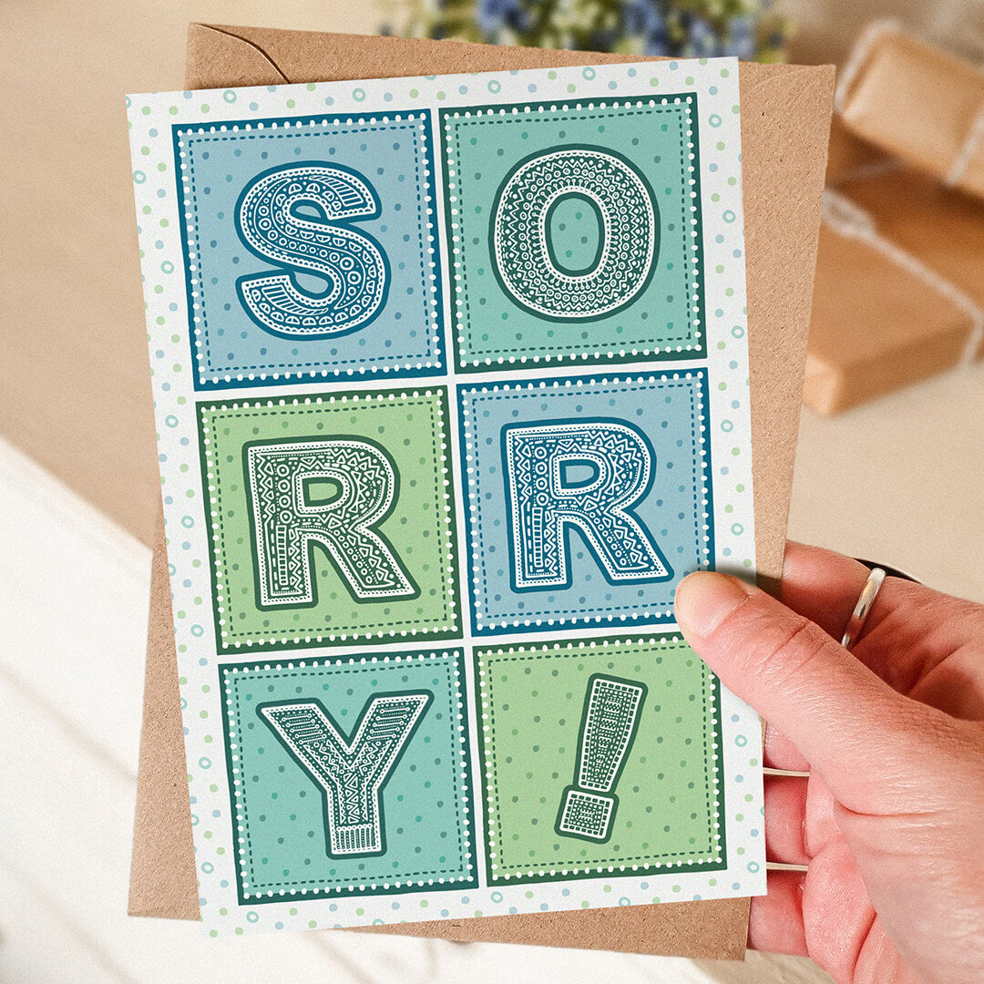 blue and green typographic sorry card Printed on fsc-certified card Blank inside