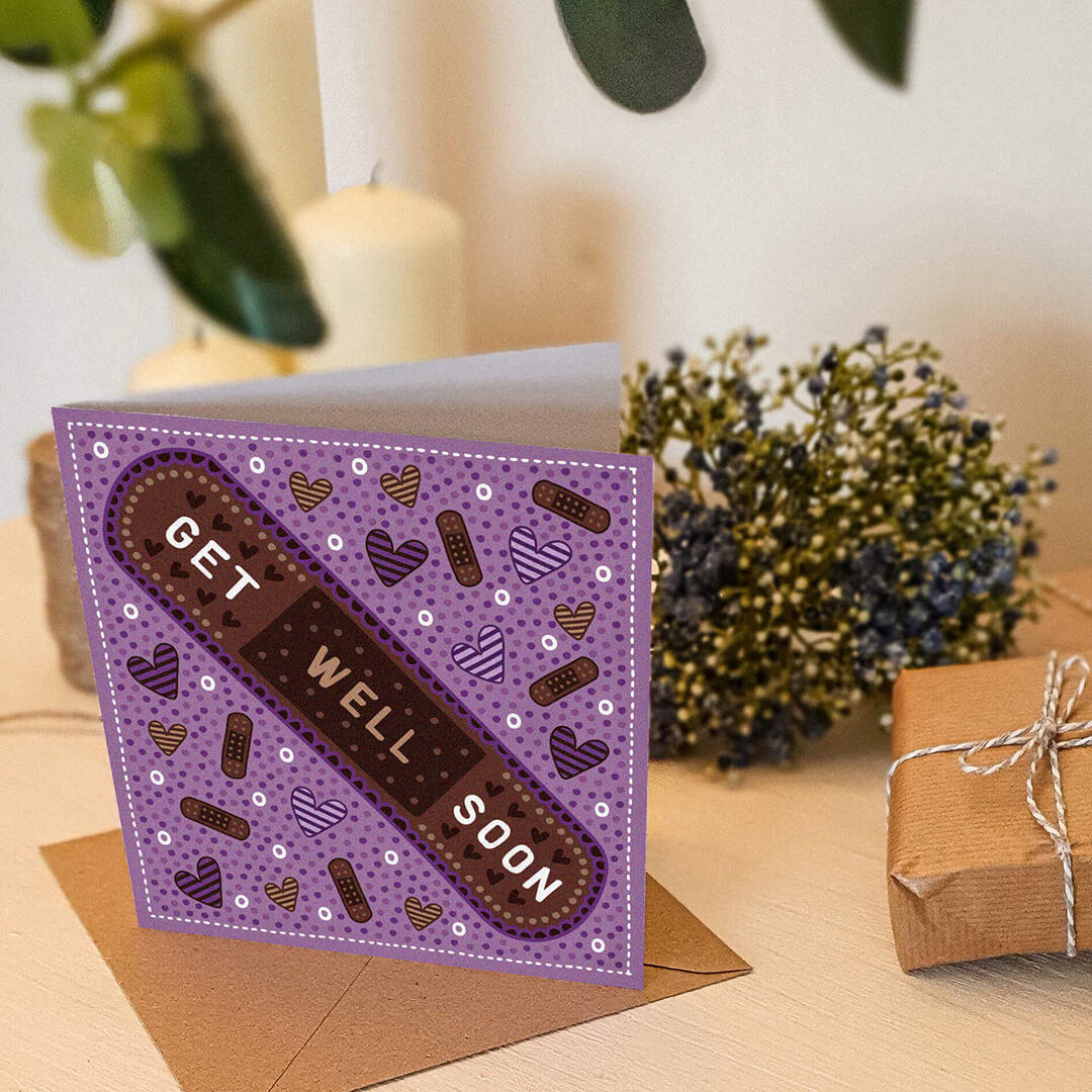 Purple cute get well soon card photographed with brown paper gifts and flowers Supplied with kraft brown recycled envelope Blank inside
