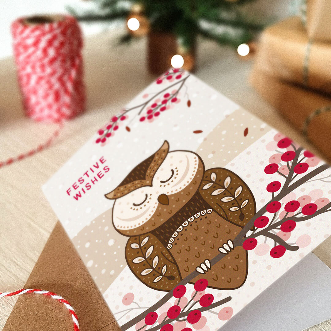 Christmas card with an owl illustration and 'Festive Wishes' message, surrounded by gifts.