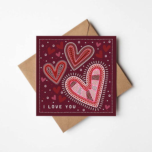 dark red romantic anniversary card featuring illustrated hearts with recycled kraft brown envelope