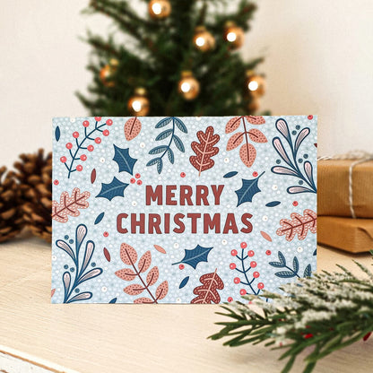 light blue botanical Christmas card with Merry Christmas message Part of festive botanical christmas card multipack Blank inside Supplied with kraft brown recycled envelopes