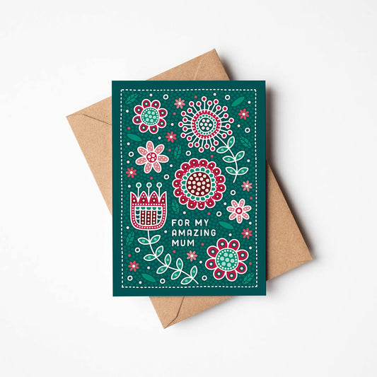 red and green floral mother's day card featuring folk art style floral illustrations and a 'for my amazing mum' message