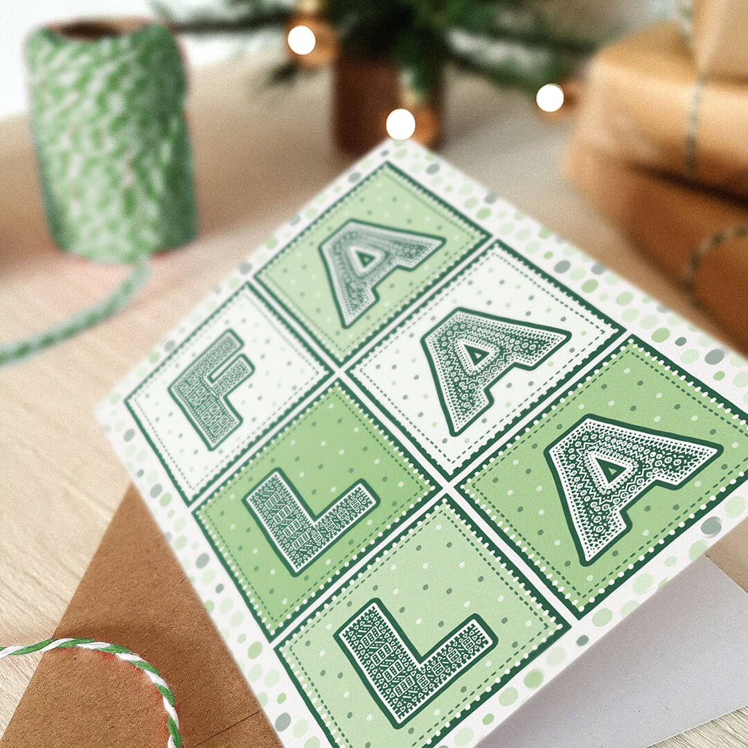 Green Christmas card with detailed typography spelling 'FA LA LA' on a festive background