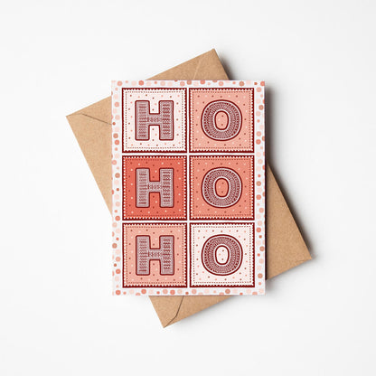 Red Ho Ho Ho Christmas card with 'HO HO HO' design on a white background
