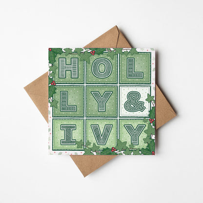 Holly & Ivy Christmas card with 'Holly & Ivy' typography and botanical illustrations on a white background