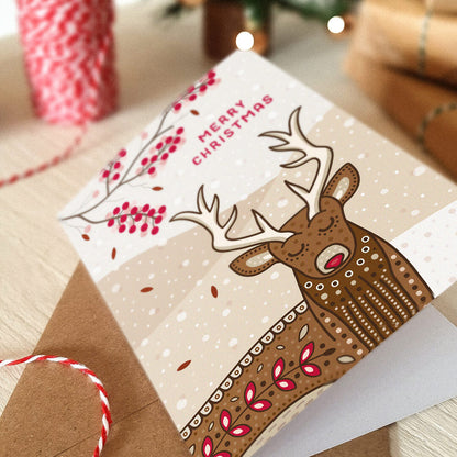 Unique illustrated stag Christmas card Cute stag Christmas card design featuring branches of festive berries Printed on FSC certified card Kraft brown recycled envelope