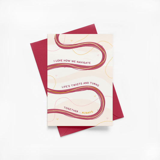 Anniversary card with wavy pink line design and red envelope on a white background