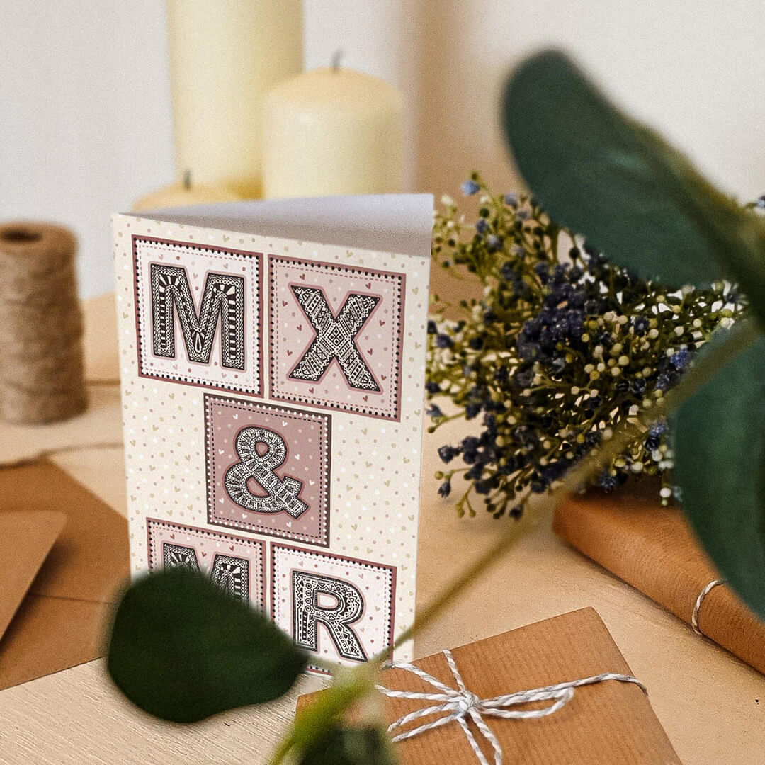 Mx and Mr gender neutral wedding card in pink and cream colour scheme featuring beautiful typography For inclusive gender neutral weddings Printed on FSC-certified card and supplied with a recycled envelope