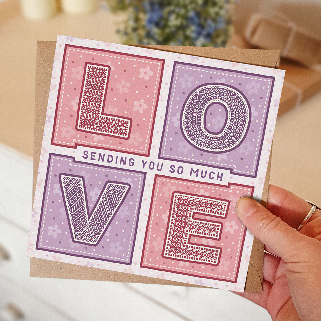 Hand holding pink and lilac thinking of you card Unique sending you so much love card Printed on fsc-certified card Supplied with kraft brown recycled envelope