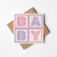 pink and purple typographic new baby card Printed on fsc-certified card Blank inside