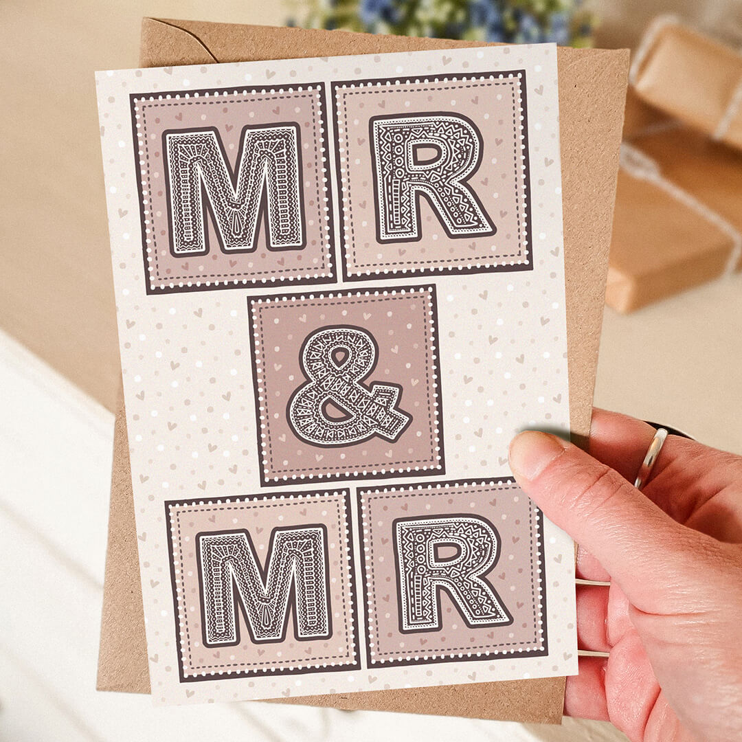 Hand holding Mr & Mr gay wedding card Unique pink cream typographic same sex wedding card Printed on FSC-certified card with kraft brown recycled envelope Blank inside