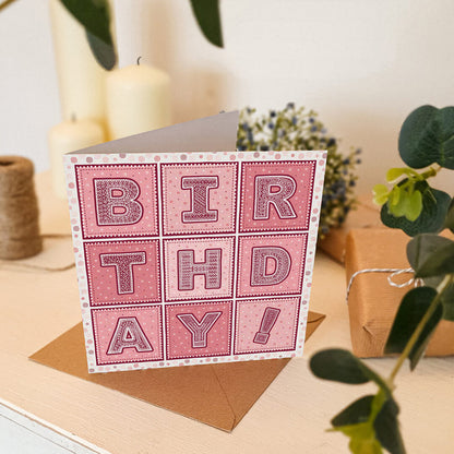 Pink typographic birthday card for friends and family Unique typographic birthday cards featuring fun and colourful design Printed on FSC-certified card with a kraft brown recycled envelope Blank inside