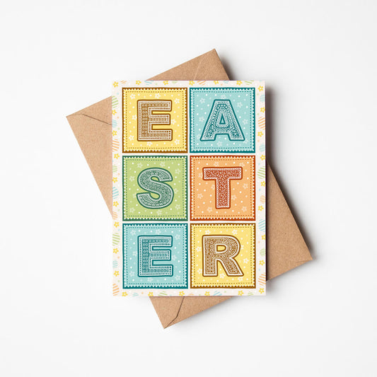 pretty typographic easter card in pastel shades of yellow, blue, orange and green