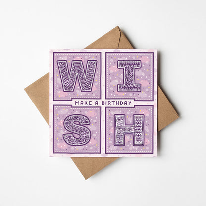 Purple birthday card with 'Make a Birthday Wish' text and a recycled brown envelope
