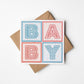 red and blue typographic new baby card Printed on fsc-certified card Blank inside