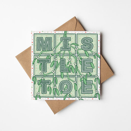 Romantic Mistletoe Christmas card with 'Mistletoe' typography and mistletoe illustration on a white background