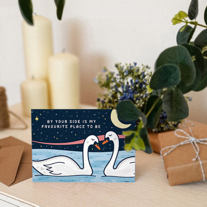 unique and romantic anniversary card featuring two swans and a night sky illustration blank inside recycled kraft brown envelope