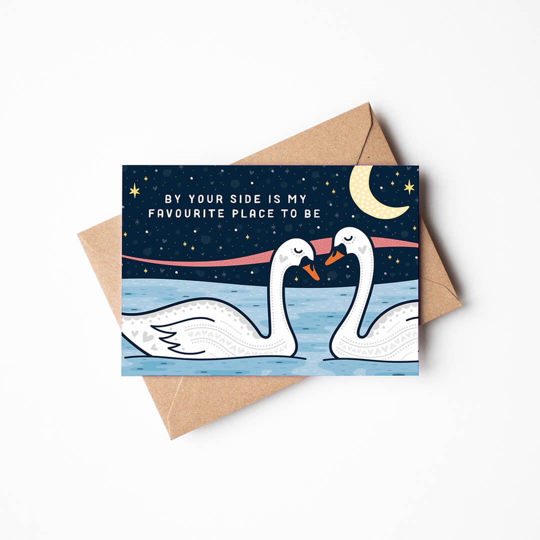 romantic swans valentines day card featuring two swans under a moonlit sky with by your side is my favourite place to be message blank inside recycled kraft brown envelope
