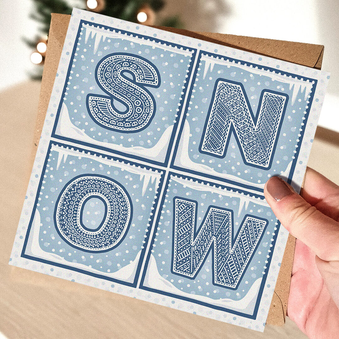 Snow Christmas Card with 'SNOW' text held by a hand 