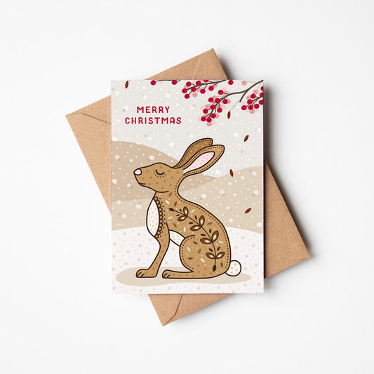 Christmas card with a rabbit or hare illustration and 'Merry Christmas' message, featuring a kraft brown envelope.