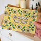 Hand holding yellow floral congratulations card with so happy for you message Unique so happy for you card Blank inside Recycled kraft brown envelope