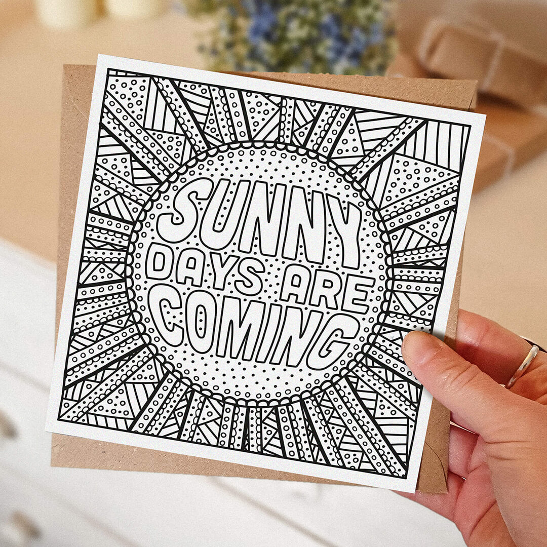 hand holding unique sunshine colouring in card Sunny Days Are Coming positive colouring in card Kraft brown recycled envelope Blank inside