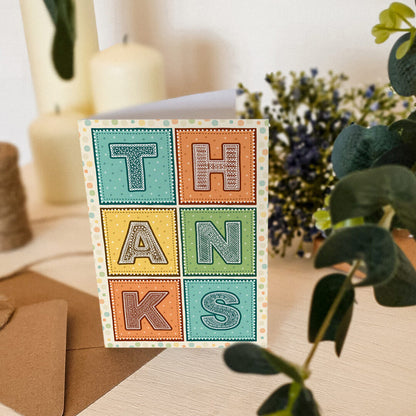 Unique and colourful typographic thank you card Turquoise orange and yellow vibrant thank you card Printed on FSC-certified card with kraft brown recycled envelope Blank inside