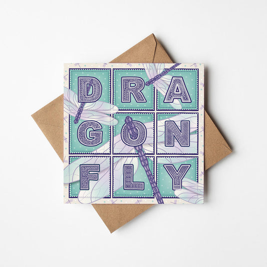 Purple and turquoise dragonfly greeting card with 'Dragonfly' text and dragonfly illustrations on a white background