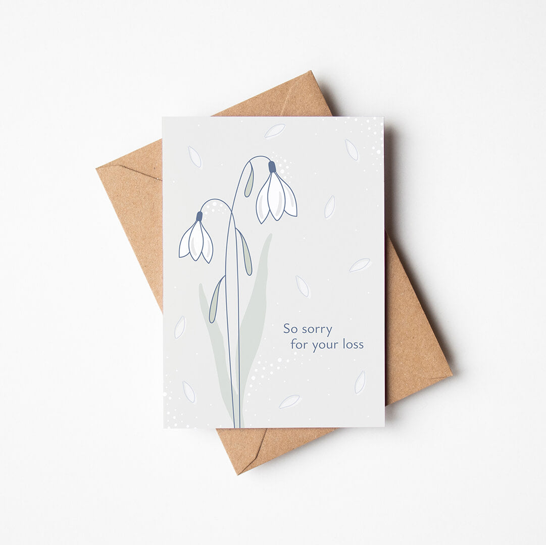 white snowdrops sympathy card with a recycled kraft brown envelope