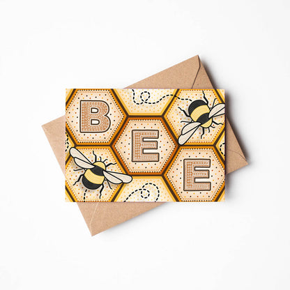 yellow and orange bee birthday card featuring unique bee illustrations and striking typography Printed on FSC-certified card and supplied with a recycled kraft brown envelope