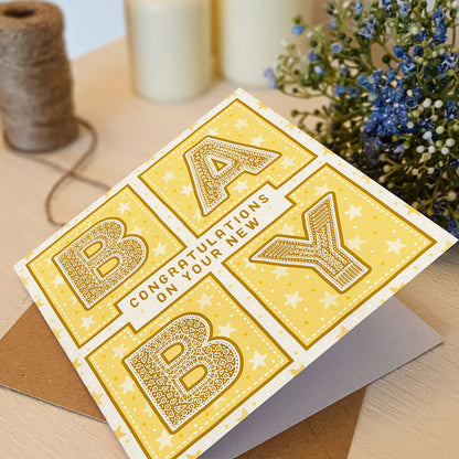 Yellow gender neutral new baby card Typographic new baby card Kraft brown recycled envelope Blank inside