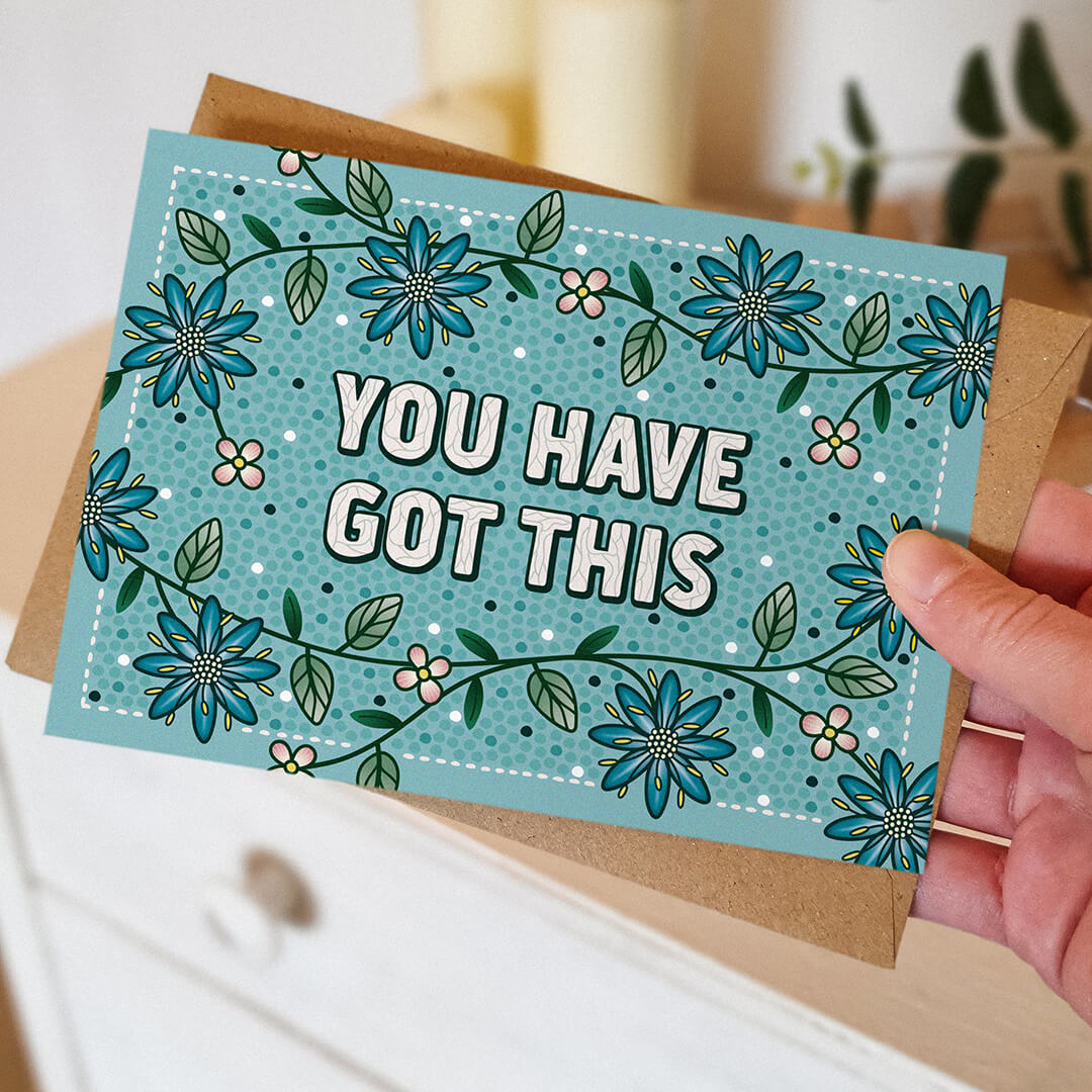 hand holding unique turquoise floral encouragement card for friend unique you have got this card blank inside recycled kraft brown envelope