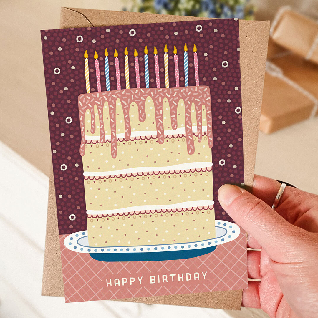 Hand holding illustrated birthday cake card Unique pink blue cream cake illustration birthday card Printed on recycled card Supplied with kraft brown recycled envelope
