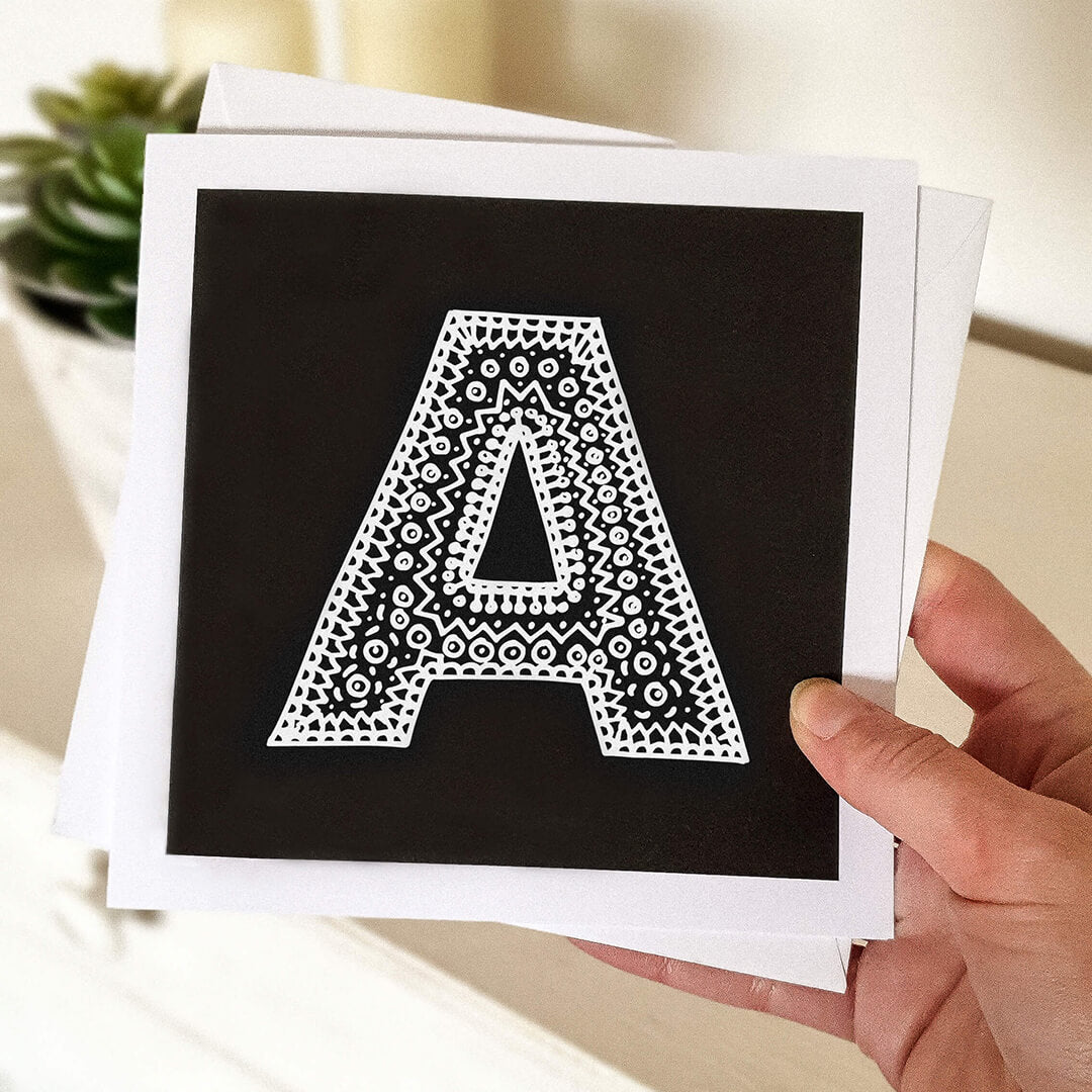 Hand holding letter A card Unique typographic greeting card Patterned black white initial greeting card Blank inside
