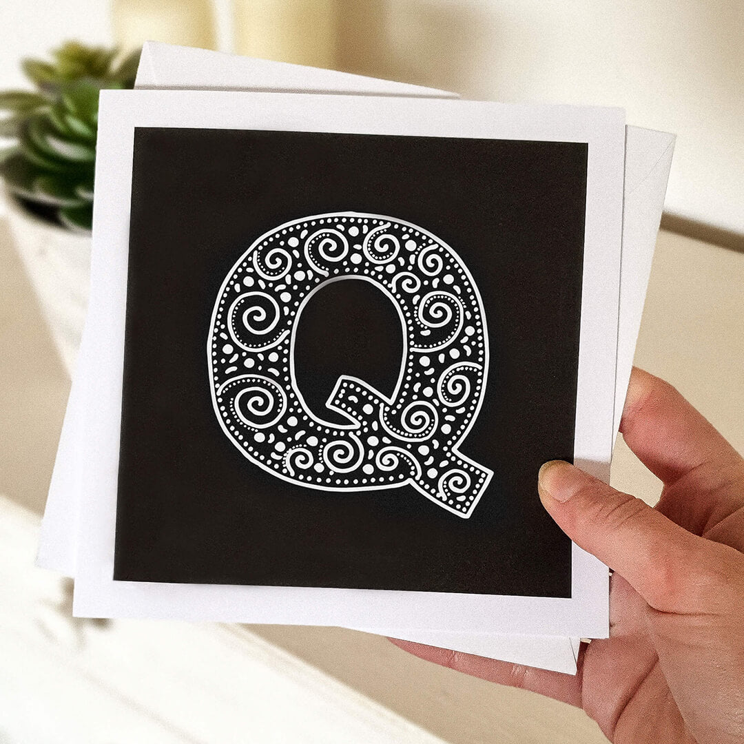 Hand holding letter Q card Unique typographic greeting card Patterned black white initial greeting card Blank inside