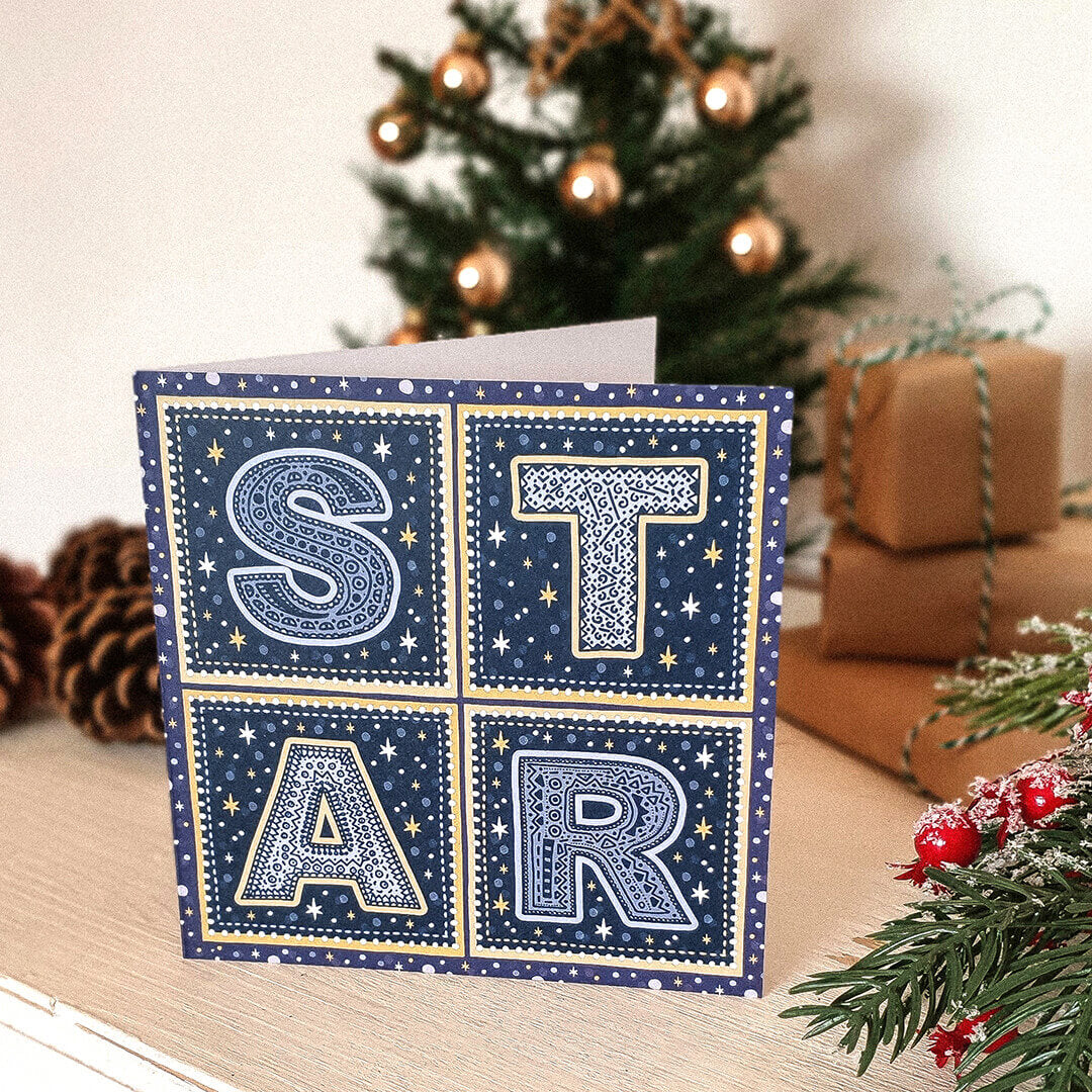 Typographic Star Christmas card Kraft Brown recycled envelope Unique typographic blue gold Star Christmas card design