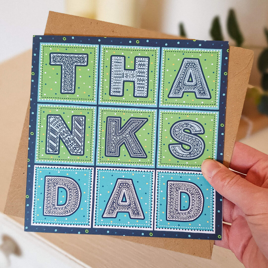 Hand holding Thanks Dad green blue Father's Day card from son Unique typographic Father's Day card Printed on recycled card Supplied with kraft brown recycled envelope