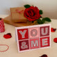 Red and pink typographic You & Me Valentine's Day card for boyfriend Printed on recycled card Kraft Brown recycled envelope Typographic You & Me design Red pink romantic card