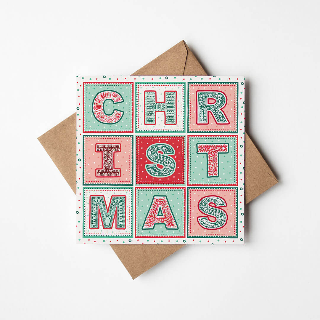 Red green cream unique typographic Christmas card featuring patterned lettering Printed on recycled card Blank inside