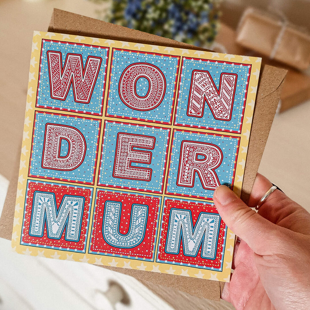 Hand holding Wonder Mum Superhero Cute Mother's Day card Unique typographic Mother's Day card Printed on recycled card Supplied with kraft brown recycled envelope